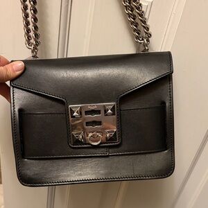 Stylish Black Crossbody Bag with Chain Detail